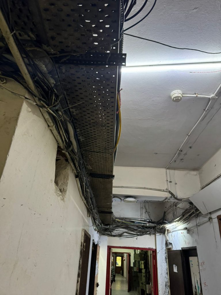 Overloaded perforated cable tray overhead