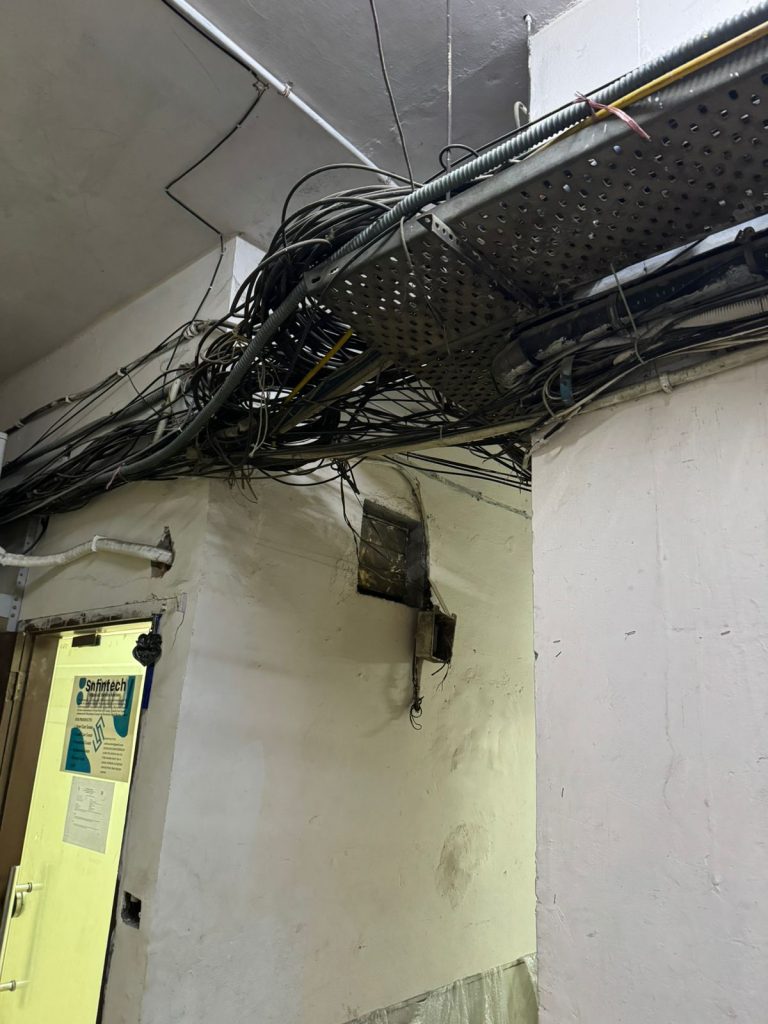Spalled ceiling showing corroded rebar 