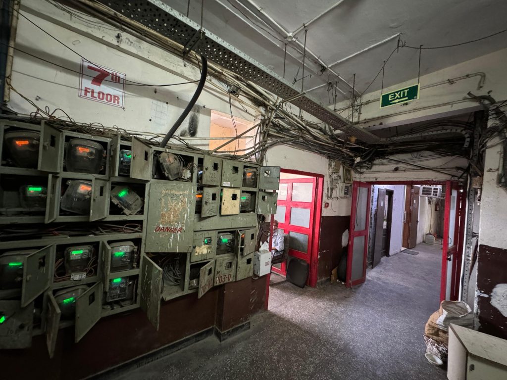 Exposed electricity meters labelled “Danger” 